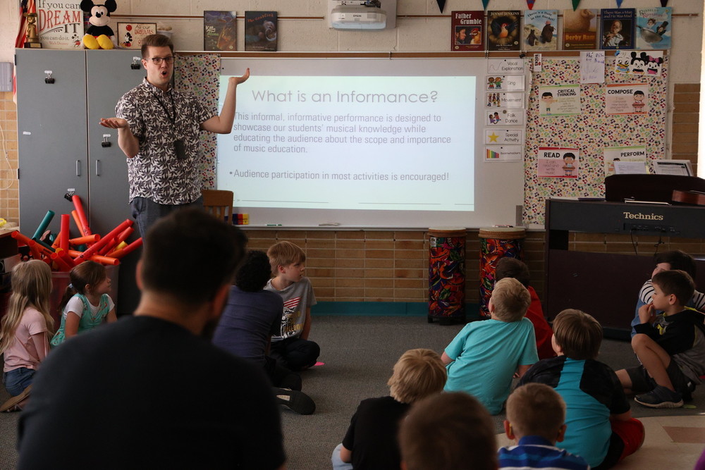 Allegan elementary music teacher Steven Wideman explains “informances” to parents.