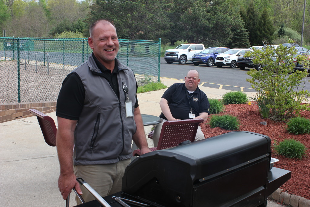 man grilling and smiling